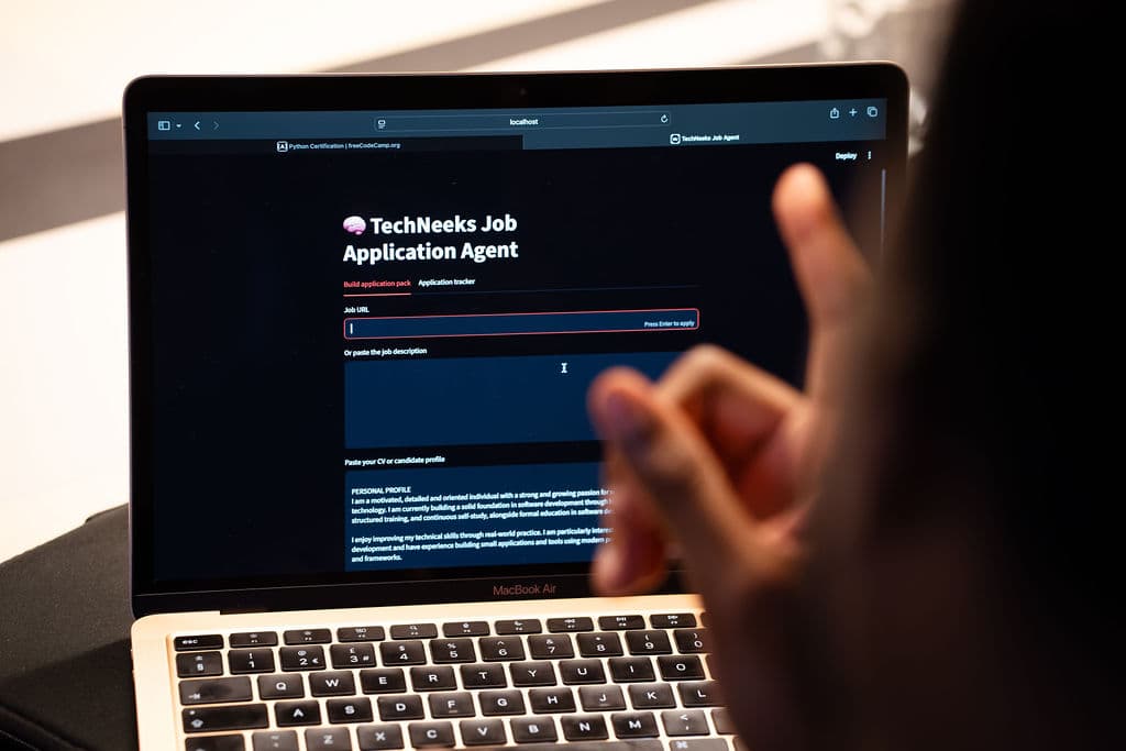 A laptop showing the AI-powered Job Assistant built at AGENT TALK