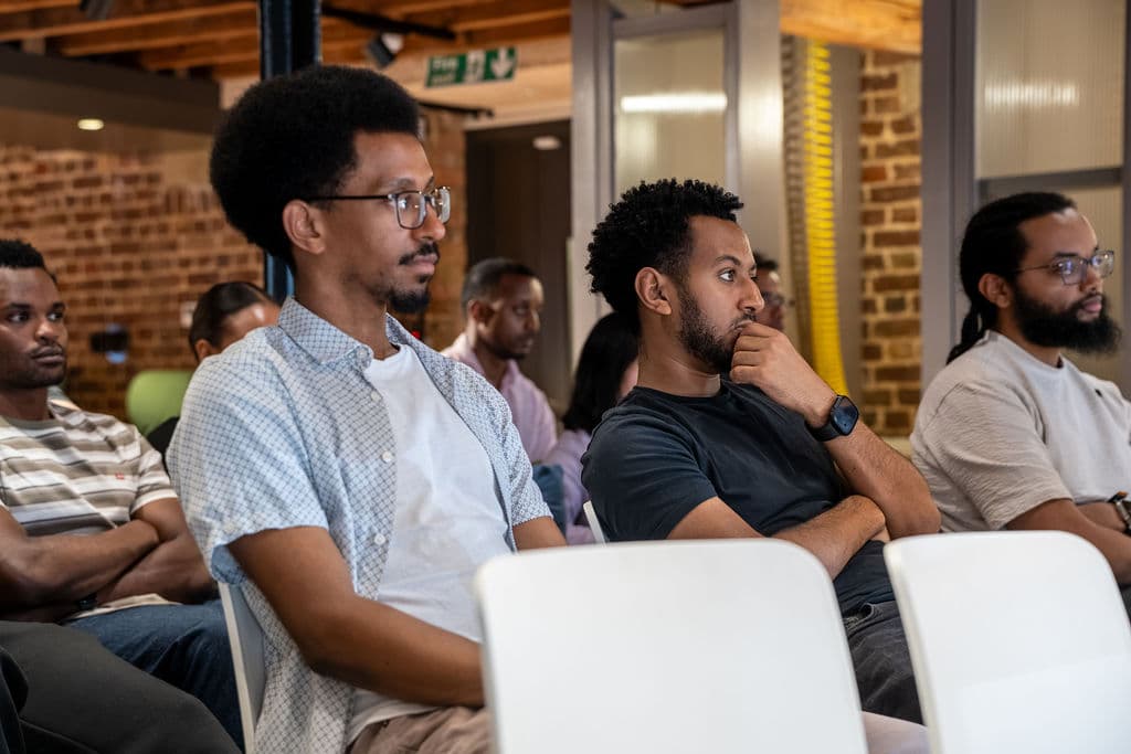 Audience members listening during the AGENT TALK panel